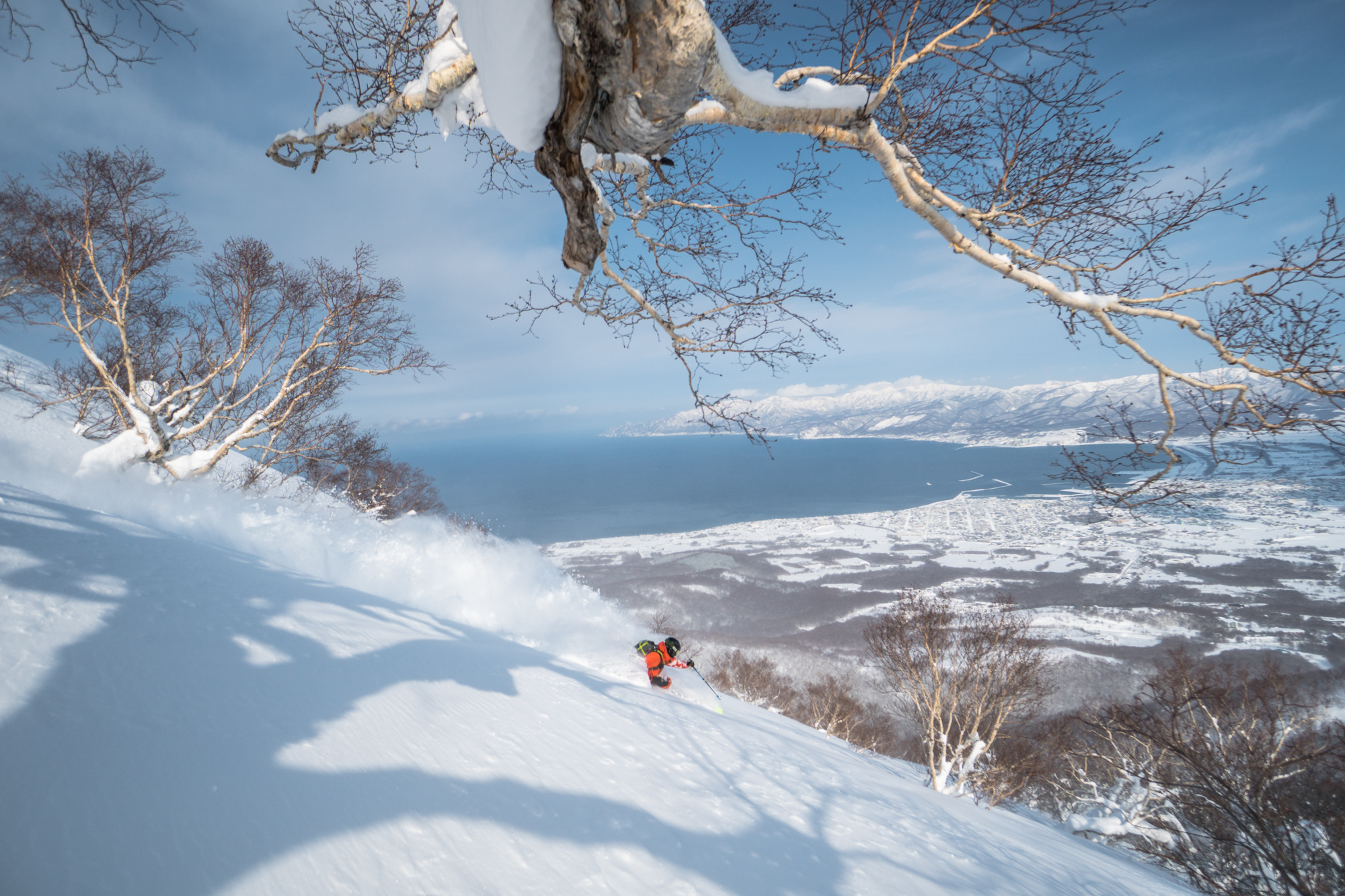 Snowmobile backcountry guiding Niseko untracked powder