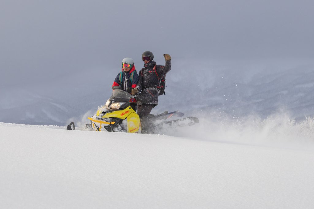 Snowmobile-accessed backcountry guiding day in Niseko