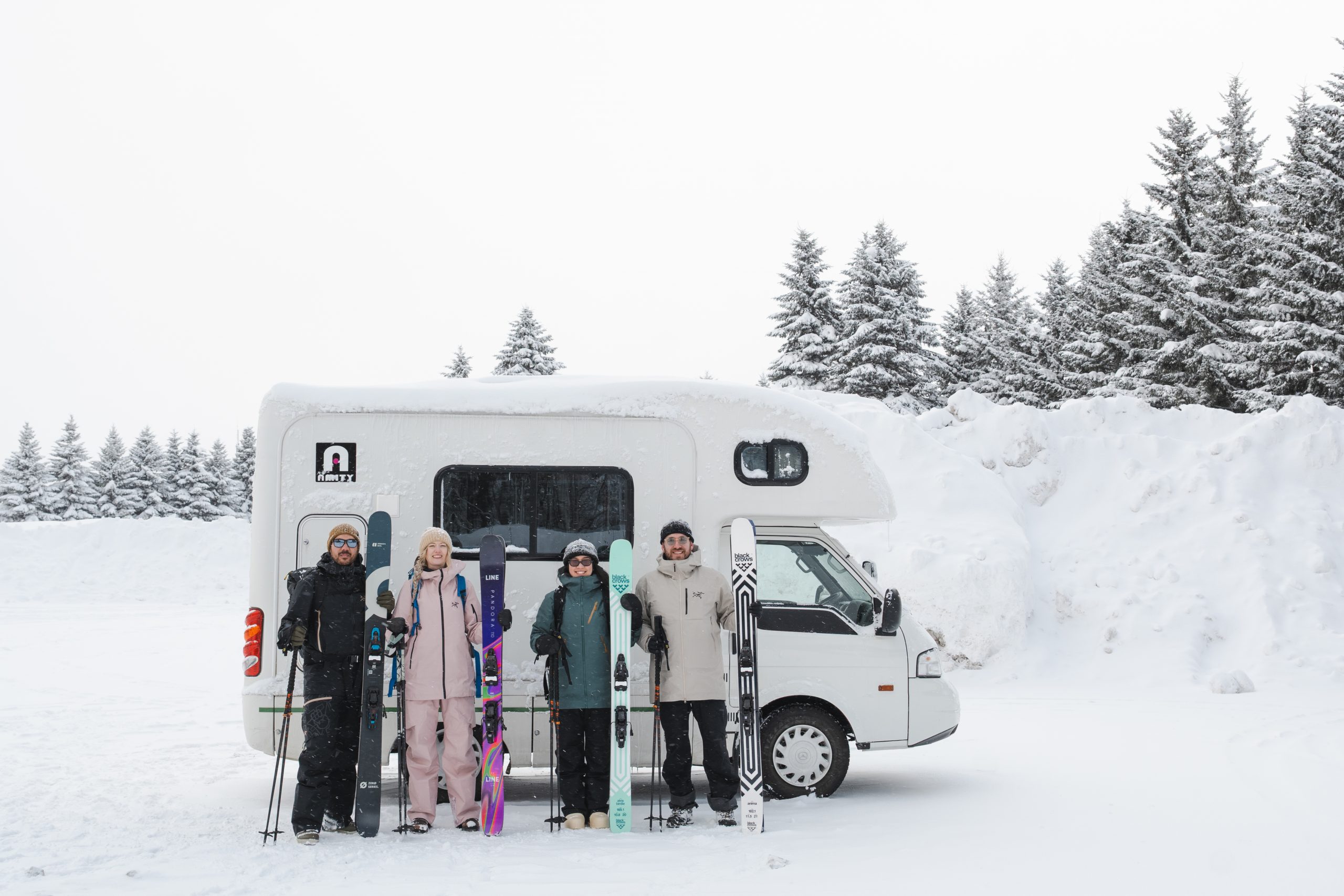 Ski and splitboard group with their touring gear, ready for a day in the Hokkaido backcountry