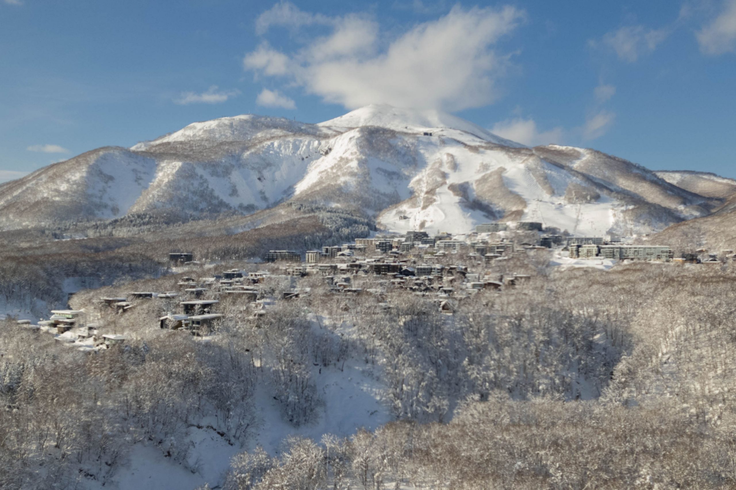 Niseko village with dining, shopping and nightlife beneath the mountains